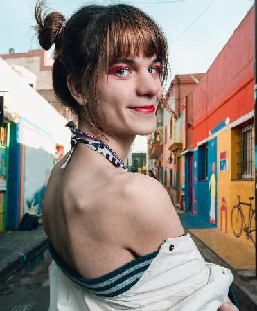 Person looking forward outdoors in the city