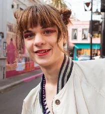 MTF individual smiling with radiant confidence