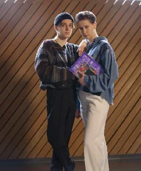Two individuals celebrating confidence and transformation